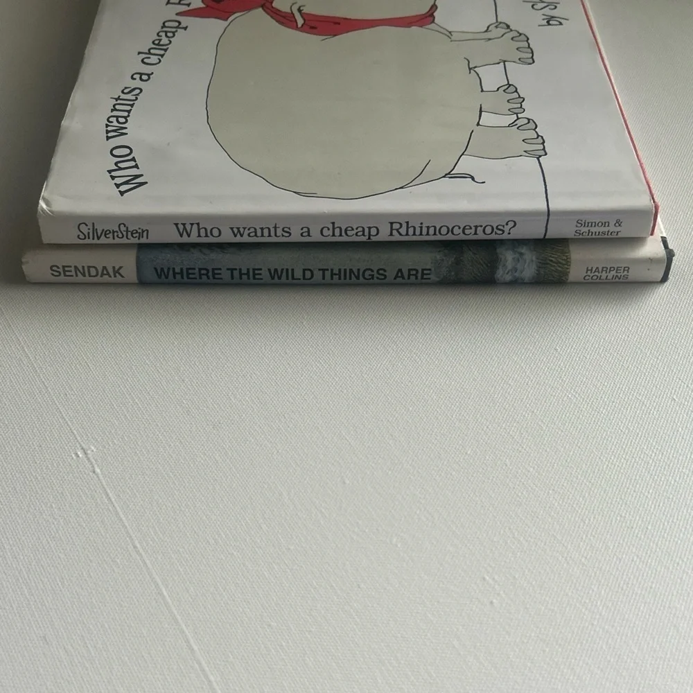 Set of 2 Where the Wild things Are Book & Who wants a cheap rhinoceros Hardback